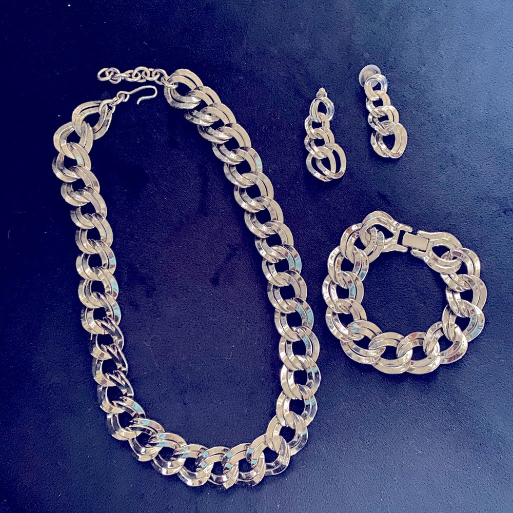 Silver necklace, bracelet and earrings